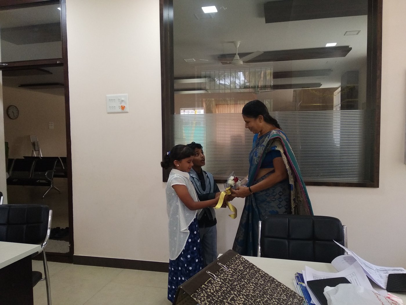 Felicitation with flowers at the centre